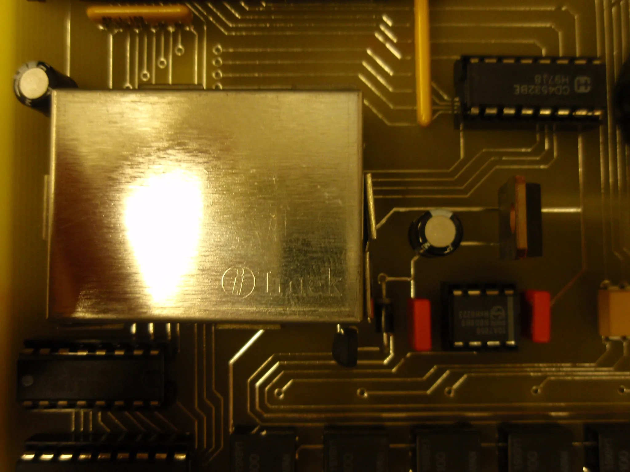 Close-up of the shielded module, with a CD4528 monostable and a TDA7050 audio amplifier beside it